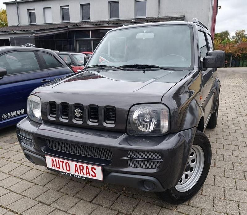 Grau Gebraucht 2012 Suzuki Jimny Comfort SUV | 14.499 € (Fairer Preis) - Bild 1/4