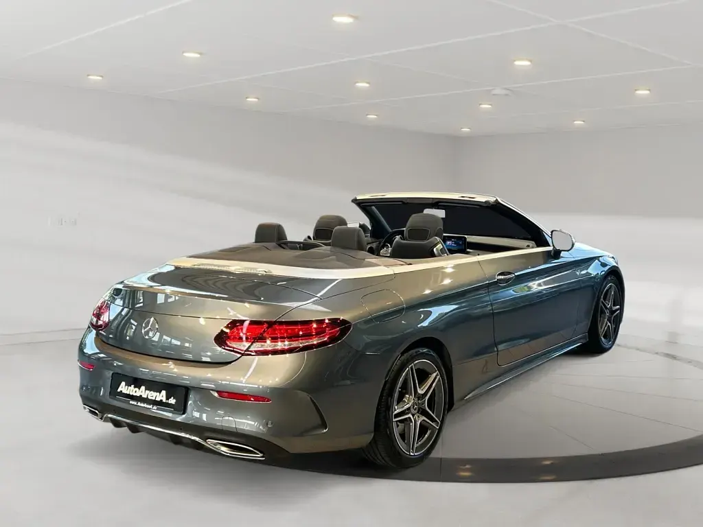 Gebraucht Mercedes C180 AMG 156 PS (114 kW) 2023 Metalliclack selenitgrau Cabrio