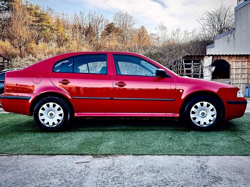 Używany Skoda Octavia 110 KM (80 kW) 2004 Czerwony Sedan/Limuzyna