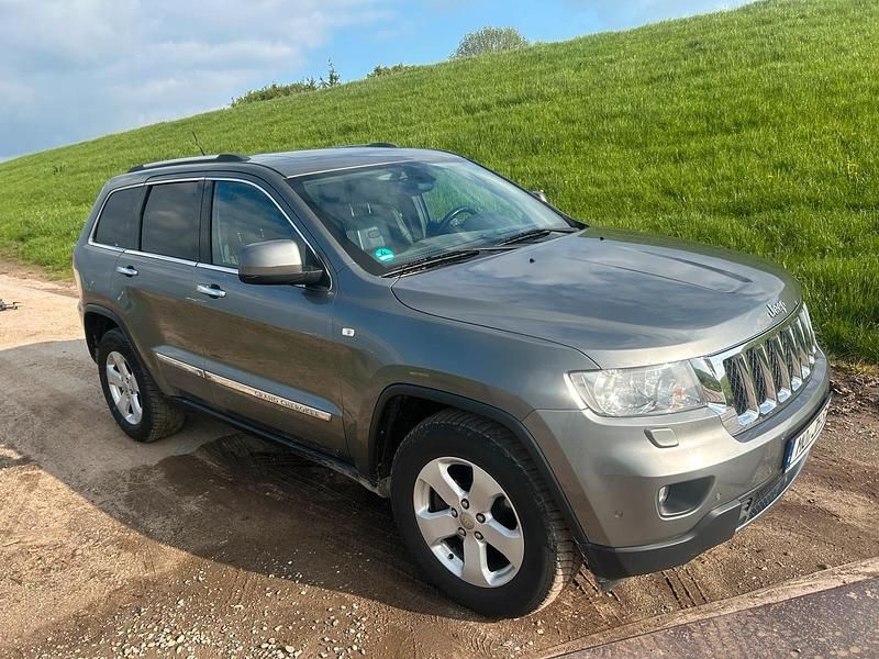 Grau Gebraucht 2012 Jeep Grand Cherokee SUV | 7.000 € - Bild 1/4