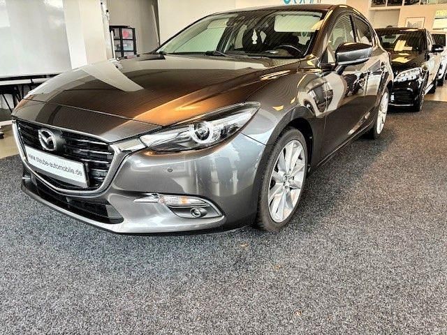 Grau Gebraucht 2018 Mazda 3 Sports-Line Limousine | 13.699 € (Fairer Preis) - Bild 1/4