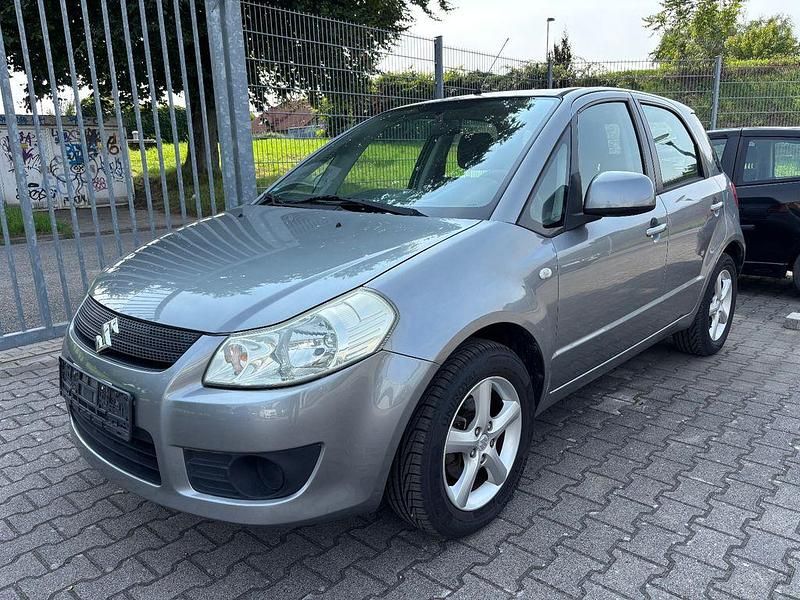 Grau Gebraucht 2009 Suzuki SX4 Comfort Limousine | 4.500 € (Guter Preis) - Bild 1/4