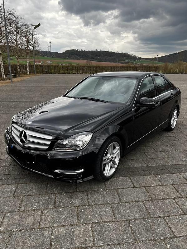 Schwarz Gebraucht 2013 Mercedes C180 AMG line Limousine | 12.200 € (Teuer) - Bild 1/4