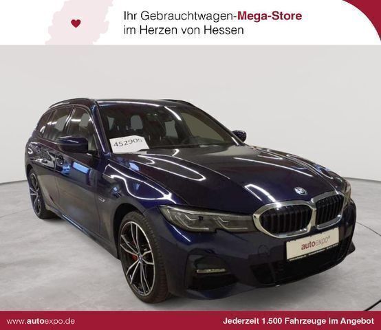 Tansanitblau ii metallic Gebraucht 2022 BMW 330e M Sport Kombi | 31.990 € (Superpreis) - Bild 1/4