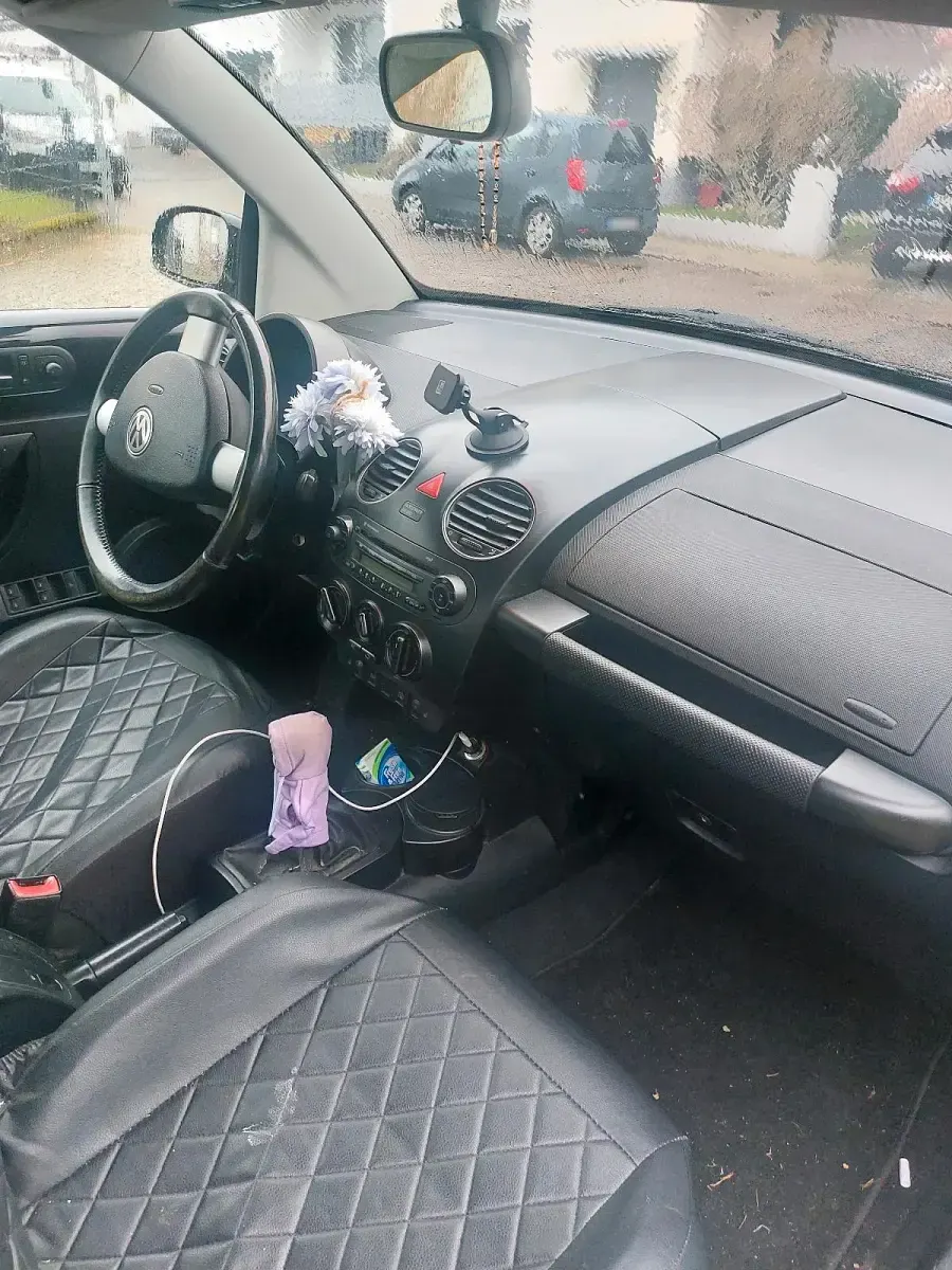 Gebraucht VW New Beetle 75 PS (55 kW) 2009 Schwarz Kleinwagen