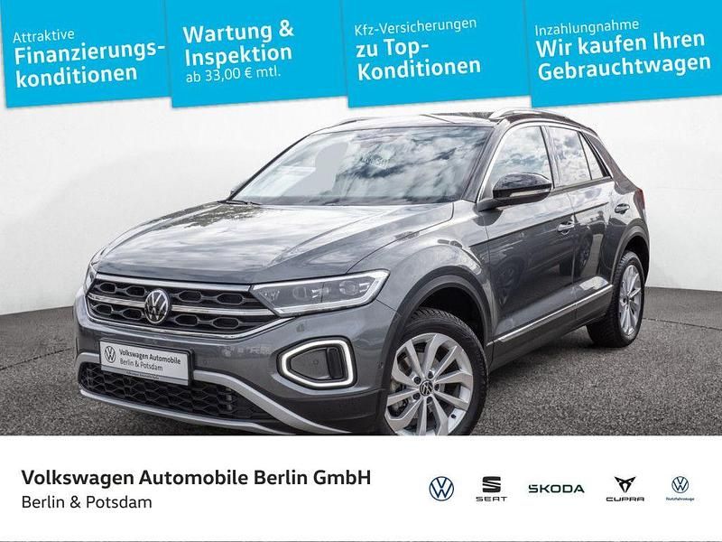 Indiumgrau metallic/schwarz Gebraucht 2024 VW T-Roc Style SUV | 29.990 € (Fairer Preis) - Bild 1/4