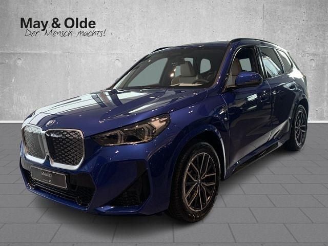 Portimao blau metallic Gebraucht 2025 BMW iX1 Performance SUV | 57.990 € - Bild 1/4