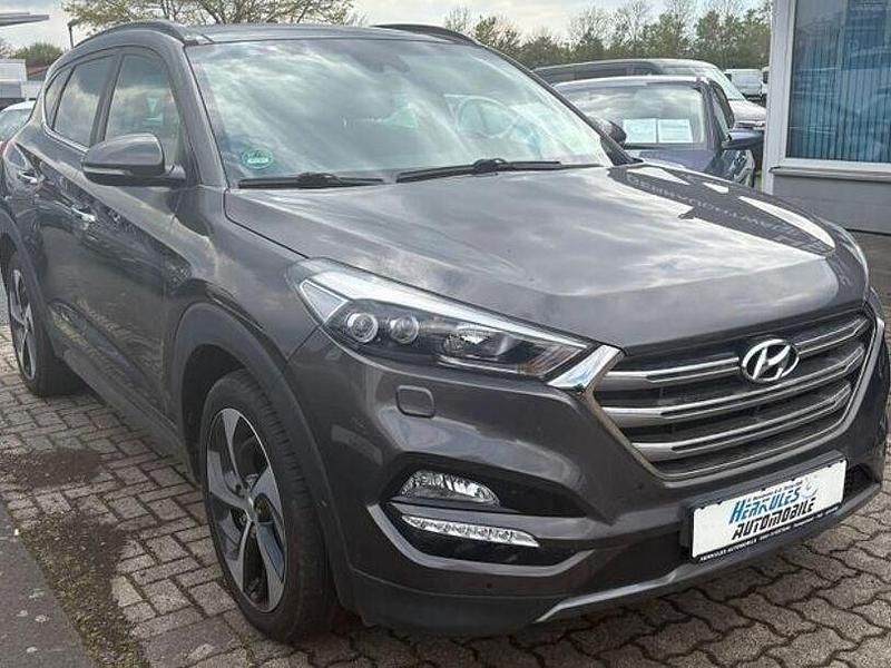 Braun Gebraucht 2016 Hyundai Tucson Premium SUV | 13.990 € (Fairer Preis) - Bild 1/4