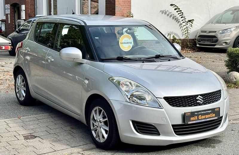 Silber Gebraucht 2013 Suzuki Swift Kleinwagen | 5.499 € - Bild 1/4