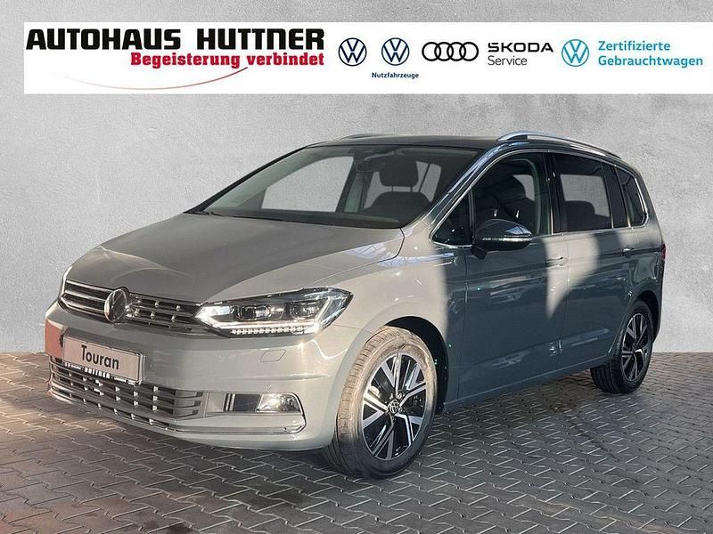 Grau Gebraucht 2024 VW Touran Highline Van / Kleinbus | 39.980 € (Teuer) - Bild 1/4