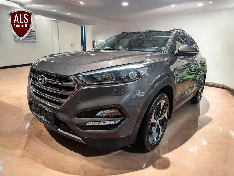 Grau Gebraucht 2015 Hyundai Tucson Premium SUV | 12.999 € (Fairer Preis) - Bild 1/4