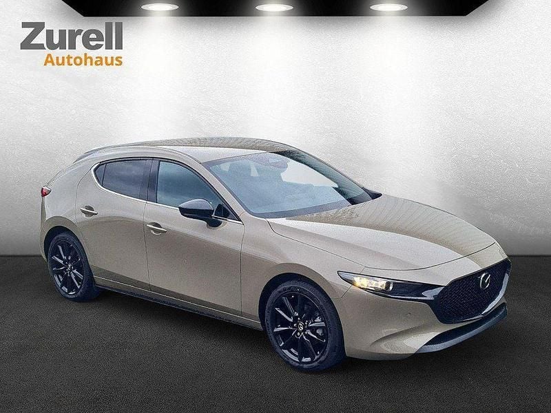 Zircon sand Neu 2025 Mazda 3 Homura-Line Limousine | 28.580 € - Bild 1/4