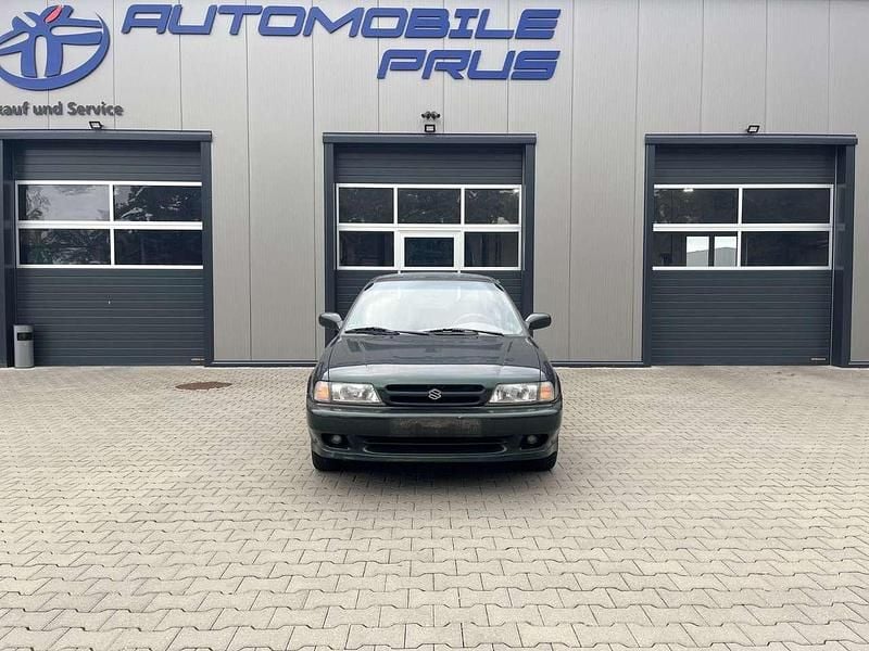 Grün Gebraucht 1998 Suzuki Baleno Limousine | 499 € - Bild 1/4