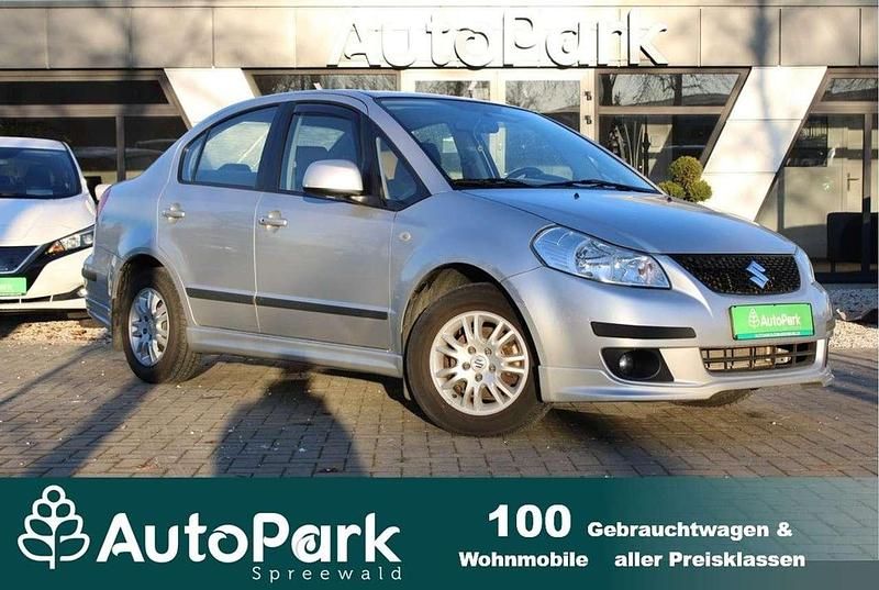Silber Gebraucht 2010 Suzuki SX4 Comfort Limousine | 5.490 € (Fairer Preis) - Bild 1/3