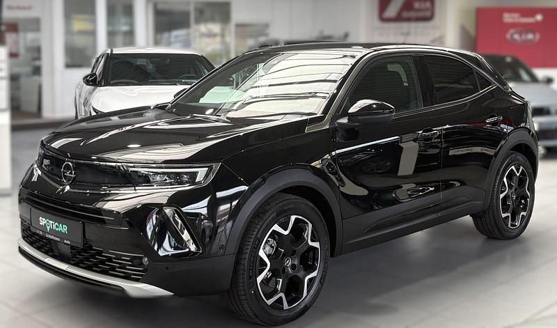 Gebraucht Opel Mokka-e Ultimate 100 kW (136 PS) 2021 Diamant schwarz/karbon schwarz SUV