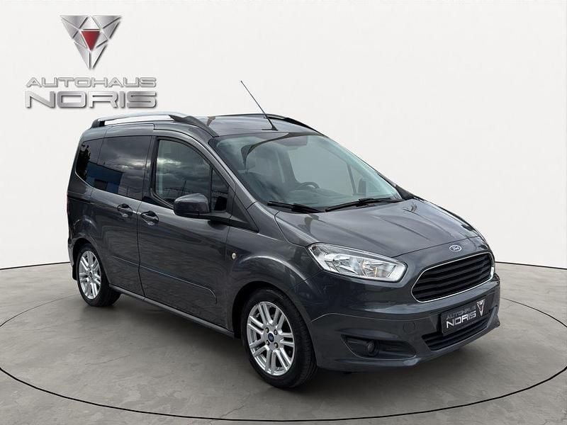 Gebraucht Ford Tourneo Courier Titanium 95 PS (69 kW) 2015 Magneticgrau (metallic) Van / Kleinbus
