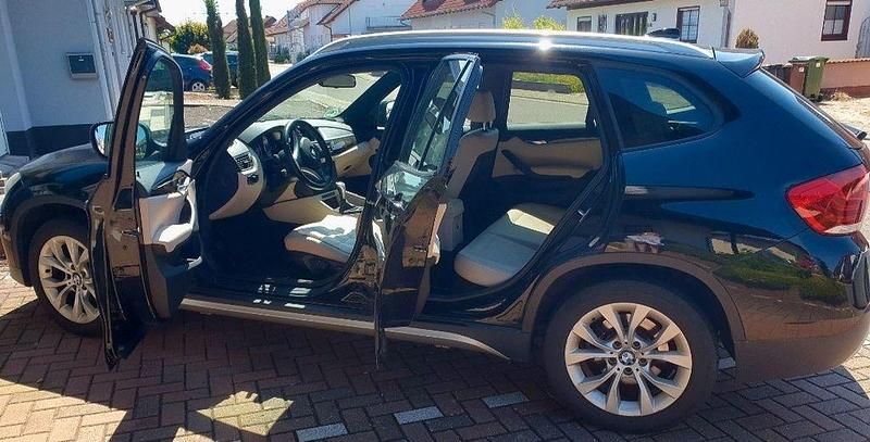 Schwarz Gebraucht 2010 BMW X1 Sport Line SUV | 5.999 € (Superpreis) - Bild 1/4