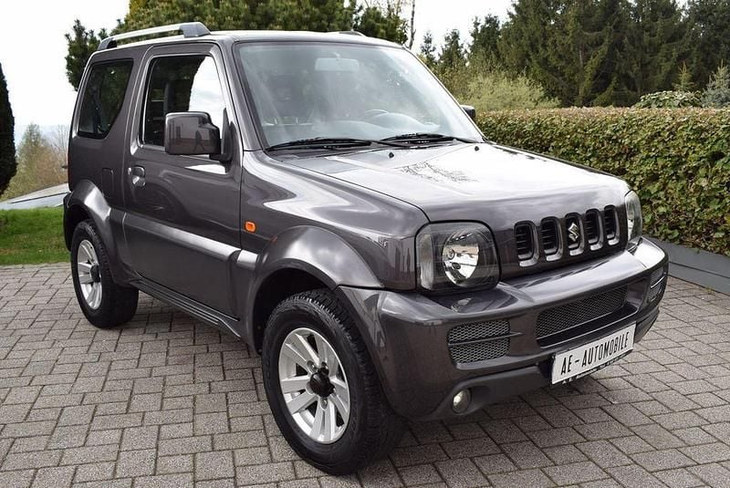 Usado Suzuki Jimny Style 86 HP (63 kW) 2012 Cinzento SUV
