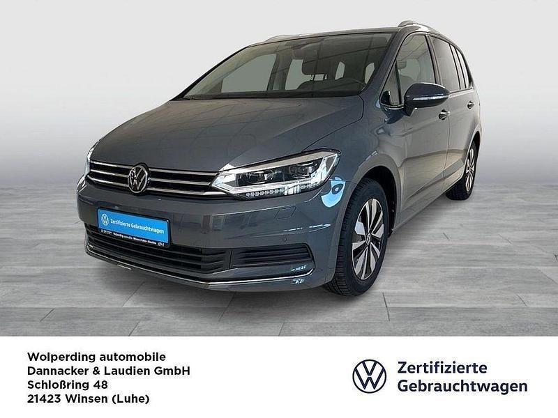 Delfingrau, metallic Gebraucht 2024 VW Touran Move Van / Kleinbus | 41.900 € (Teuer) - Bild 1/4