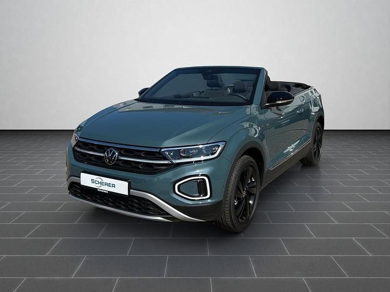 Petroleum blue metallic / schwarz (metallic) Gebraucht 2025 VW T-Roc SUV | 34.890 € (Fairer Preis) - Bild 1/4