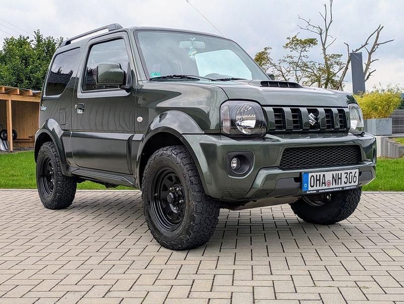 Grün Gebraucht 2018 Suzuki Jimny Ranger Comfort SUV | 19.500 € (Fairer Preis) - Bild 1/4