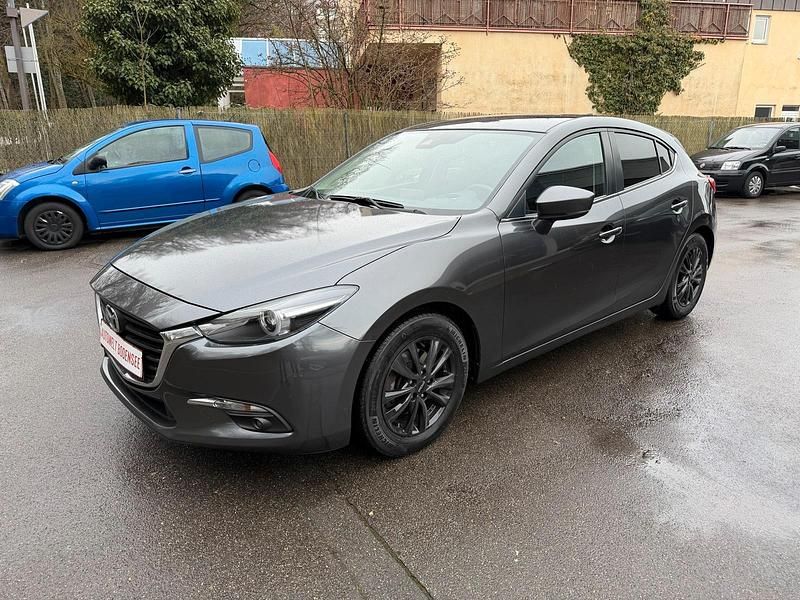 Grau Gebraucht 2017 Mazda 3 Exclusive-Line Limousine | 11.900 € (Fairer Preis) - Bild 1/4