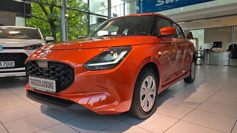 Orange Neu 2025 Suzuki Swift Club Limousine | 15.950 € - Bild 1/4