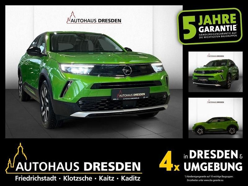 Matcha green/ikone gruen (metallic) Gebraucht 2022 Opel Mokka-e Elegance SUV | 15.490 € (Guter Preis) - Bild 1/4