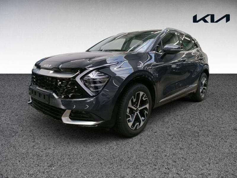 H8g) pentametal met. (grau Gebraucht 2024 Kia Sportage Spirit SUV | 31.480 € (Guter Preis) - Bild 1/4
