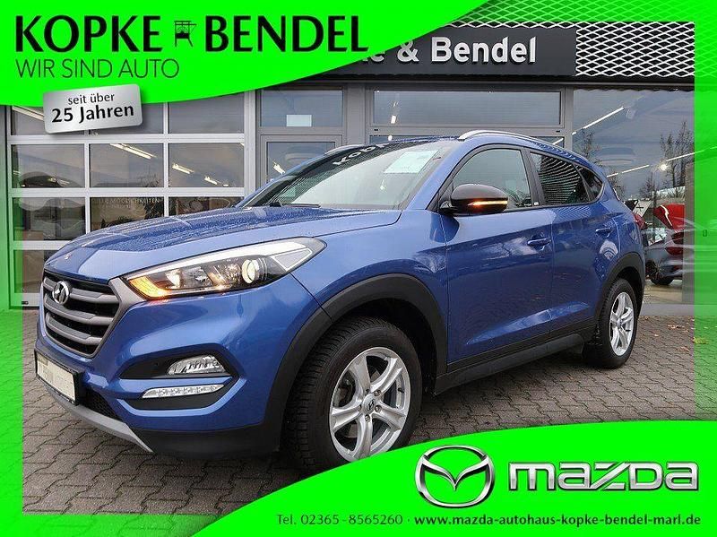 Champion blue metallic (metallic) Gebraucht 2018 Hyundai Tucson Passion SUV | 14.970 € (Fairer Preis) - Bild 1/4