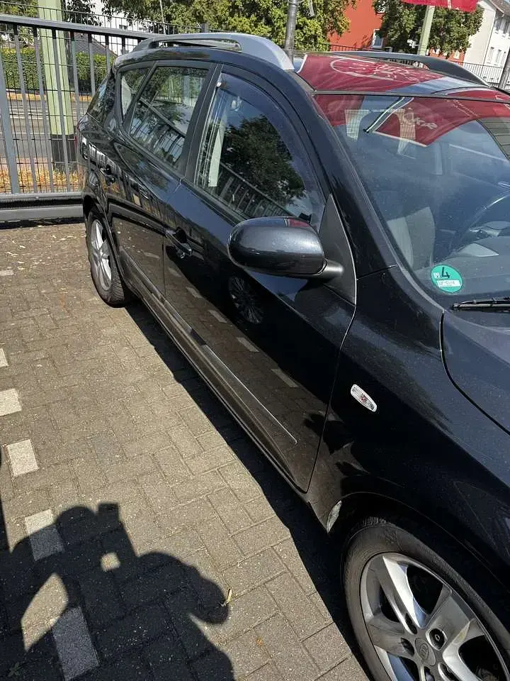 Gebraucht Kia Ceed Sportswagon Edition 7 125 PS (91 kW) 2011 Schwarz Kombi