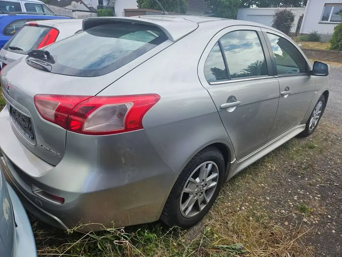 Gebraucht Mitsubishi Lancer 150 PS (110 kW) 2013 Merkursilber (m) Limousine