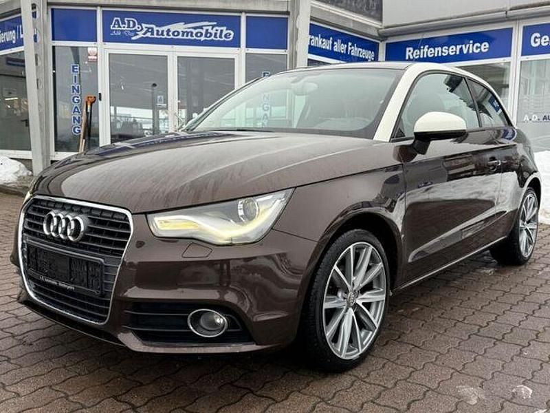 Braun Gebraucht 2012 Audi A1 Ambition Limousine | 6.490 € - Bild 1/4