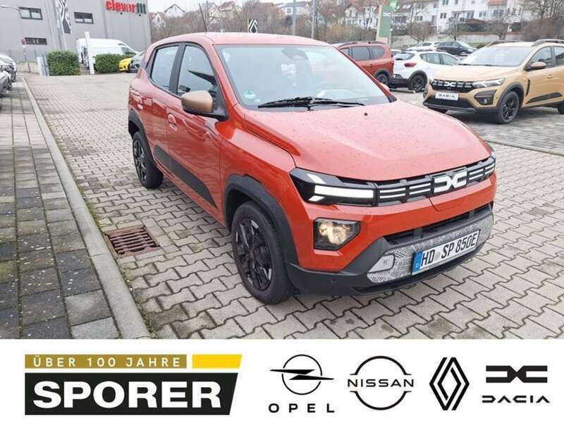 Brick red Neu 2024 Dacia Spring Extreme Kleinwagen | 17.990 € (Fairer Preis) - Bild 1/4