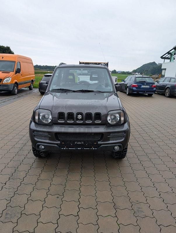 Grau Gebraucht 2012 Suzuki Jimny SUV | 10.000 € (Fairer Preis) - Bild 1/4