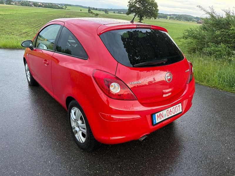 Gebraucht Opel Corsa Satellite 69 PS (50 kW) 2011 Magma rot (b) Kleinwagen