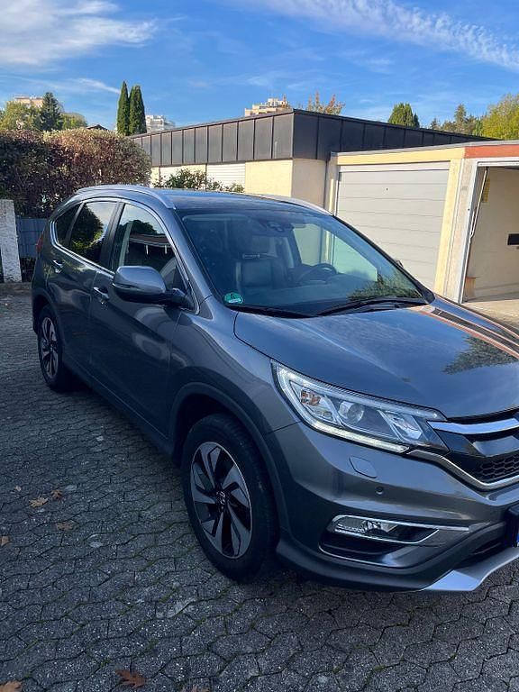 Grau Gebraucht 2017 Honda CR-V Executive SUV | 22.300 € (Teuer) - Bild 1/4