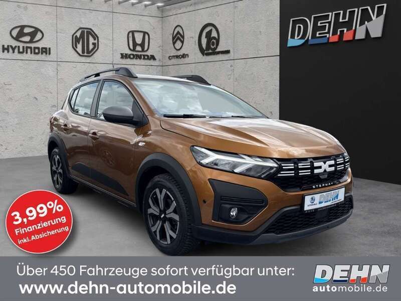 Atacamaorange Gebraucht 2023 Dacia Sandero Expression Kleinwagen | 16.450 € (Fairer Preis) - Bild 1/4