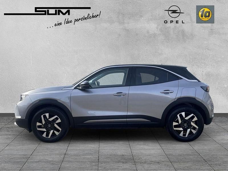 Gebraucht Opel Mokka-e Elegance 100 kW (136 PS) 2023 Kontrast grau/quarz silber SUV