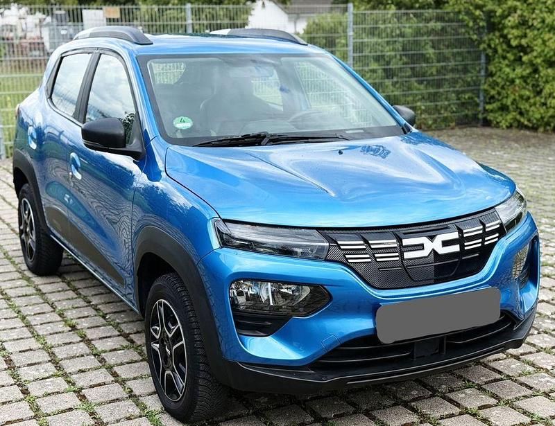 Blau Gebraucht 2024 Dacia Spring Essentiel Kleinwagen | 9.999 € - Bild 1/4