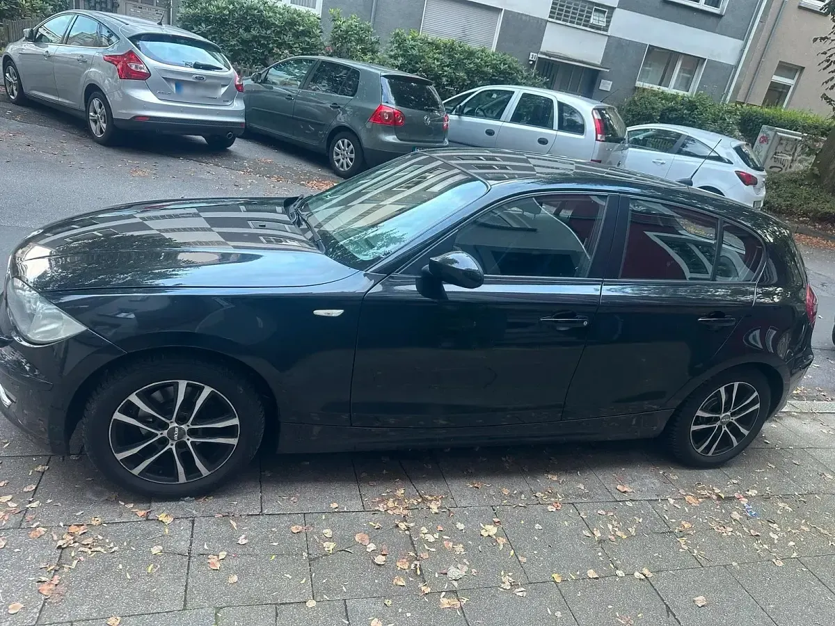Second-hand BMW 116 122 CP (89 kW) 2009 Negru Hatchback
