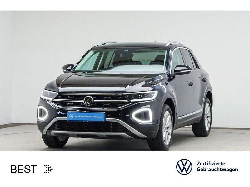 Deep black perleffekt (metallic) Gebraucht 2024 VW T-Roc Style SUV | 28.249 € (Guter Preis) - Bild 1/3