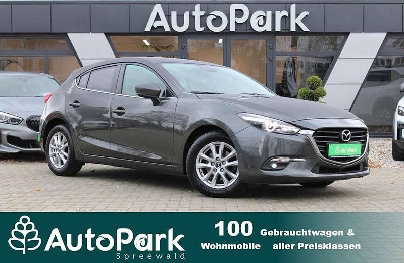 Grau Gebraucht 2018 Mazda 3 Exclusive-Line Limousine | 13.890 € (Fairer Preis) - Bild 1/3