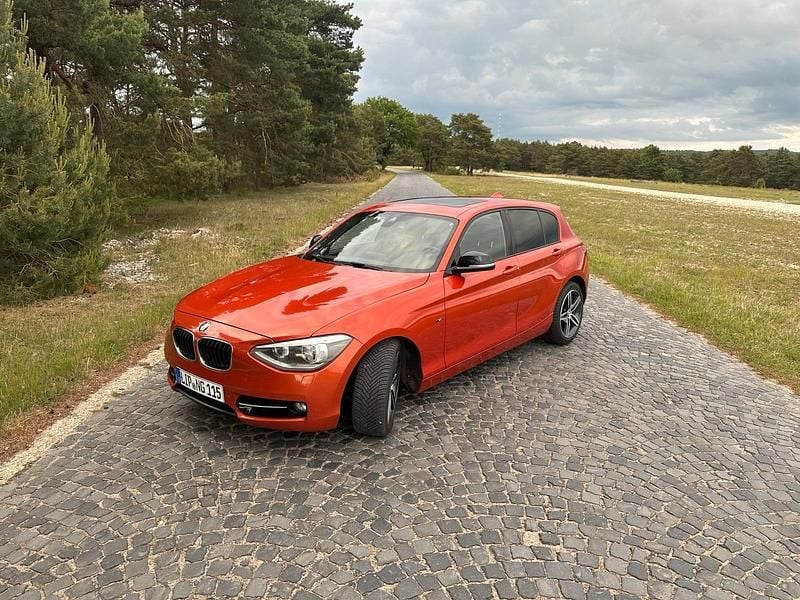Orange Gebraucht 2012 BMW 120 Sport Line Kleinwagen | 9.900 € (Fairer Preis) - Bild 1/4