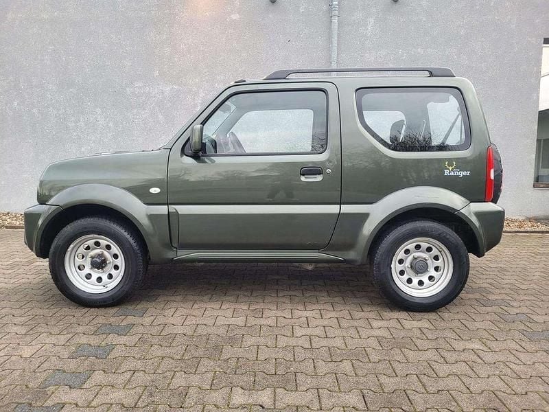 Grün Gebraucht 2015 Suzuki Jimny Club SUV | 12.900 € (Fairer Preis) - Bild 1/4