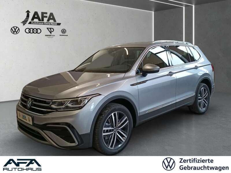 Pyritsilber metallic Gebraucht 2024 VW Tiguan Allspace Elegance SUV | 40.443 € (Superpreis) - Bild 1/4