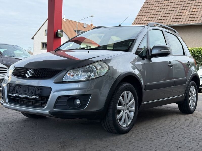 Grau Gebraucht 2012 Suzuki SX4 Style SUV | 6.999 € (Fairer Preis) - Bild 1/4