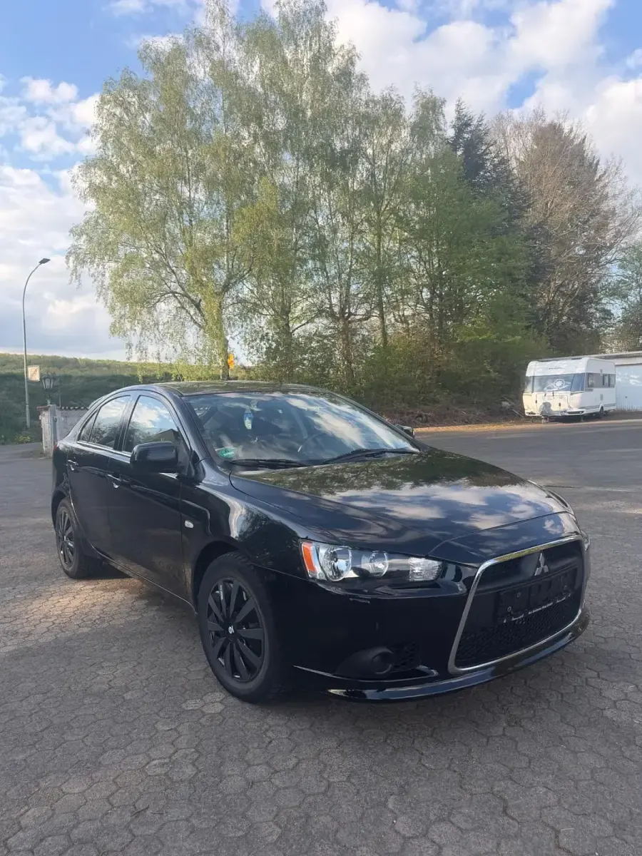 Second-hand Mitsubishi Lancer 143 CP (105 kW) 2009 Negru Berlinǎ