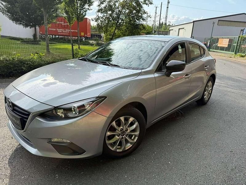 Plutossilber metallic Gebraucht 2015 Mazda 3 Prime-Line Kleinwagen | 7.990 € (Fairer Preis) - Bild 1/4