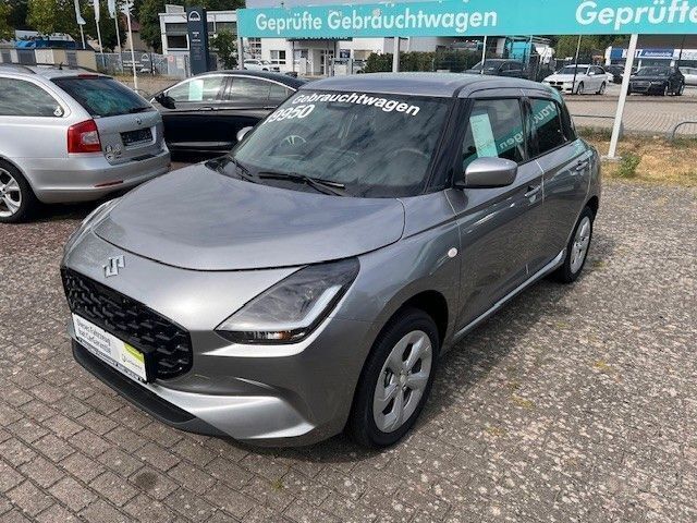 Grau Neu 2024 Suzuki Swift Comfort+ Limousine | 19.950 € - Bild 1/4